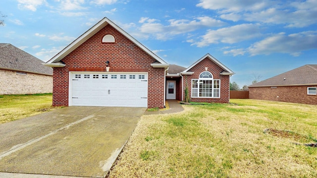 front facade featuring a garage and a front yard