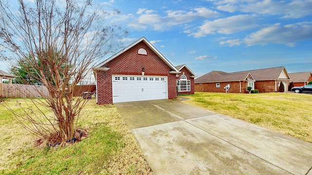 view of front of home with a garage and a front lawn