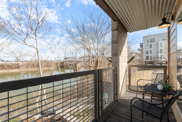 balcony featuring a water view