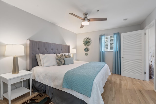 bedroom featuring ceiling fan and light hardwood / wood-style floors