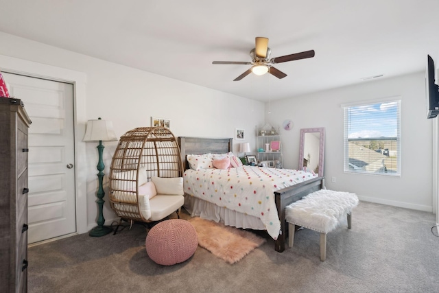 bedroom featuring ceiling fan and dark carpet