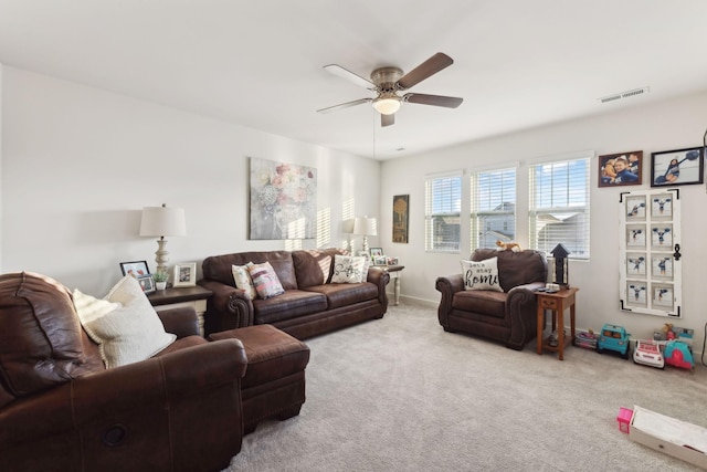 living room with light carpet and ceiling fan