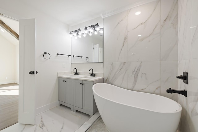 bathroom featuring vanity and a bath