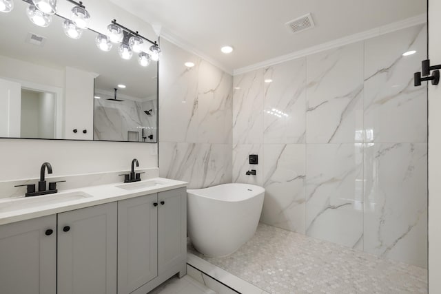 bathroom featuring vanity, ornamental molding, and independent shower and bath