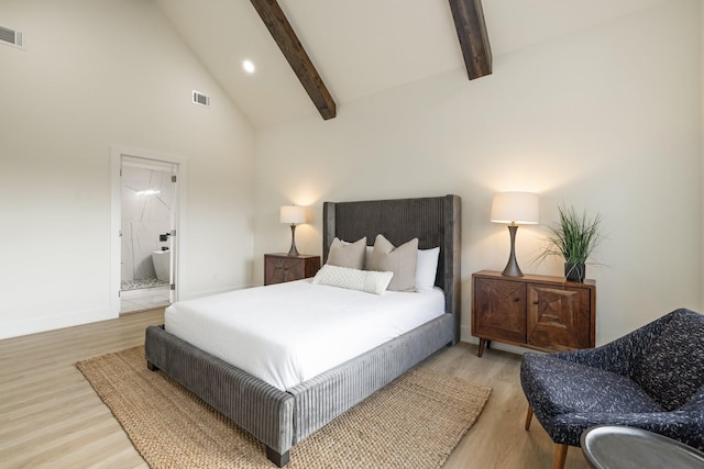 bedroom with beam ceiling, high vaulted ceiling, and light hardwood / wood-style flooring