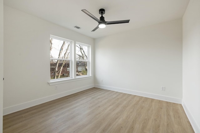 spare room featuring ceiling fan and light wood-type flooring