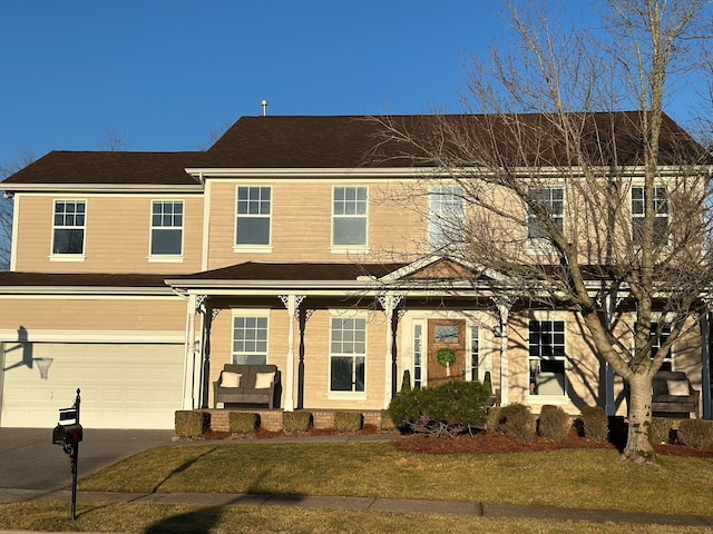 view of front facade featuring a garage and a front yard