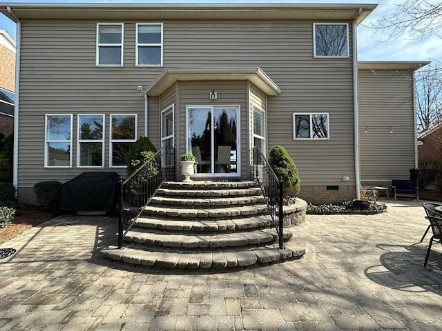 back of house featuring a patio