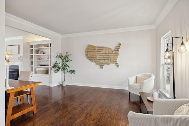 sitting room featuring crown molding and dark hardwood / wood-style floors