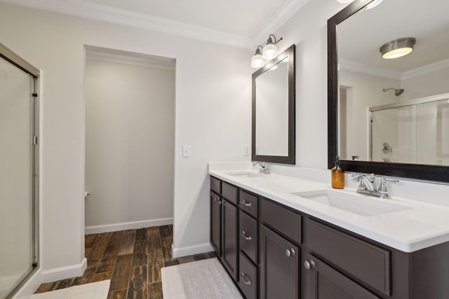 bathroom with an enclosed shower, ornamental molding, wood-type flooring, and vanity