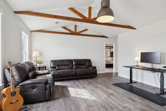 living room with hardwood / wood-style flooring and lofted ceiling with beams