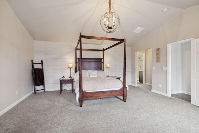 carpeted bedroom featuring a chandelier and vaulted ceiling