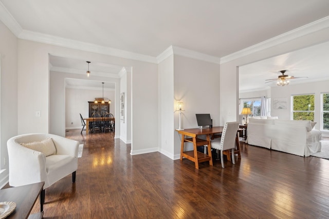 dining space with ornamental molding, dark wood-type flooring, and ceiling fan