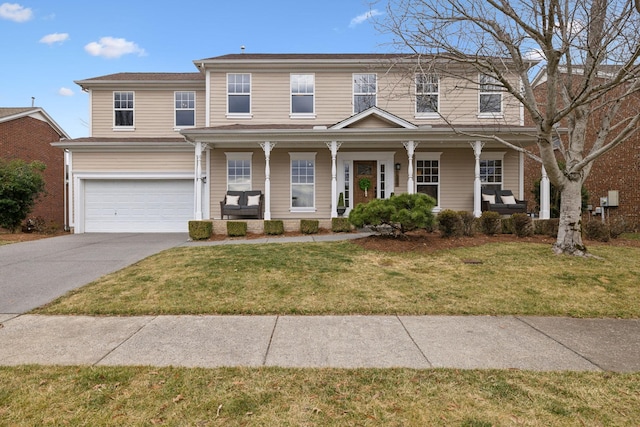 view of front facade featuring a garage, covered porch, and a front lawn