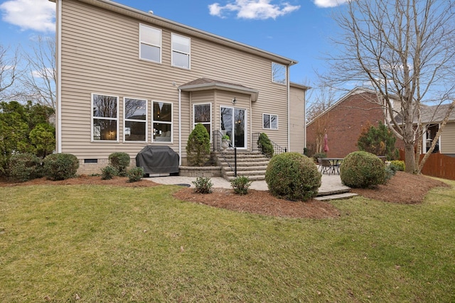 view of front facade with a patio and a front lawn