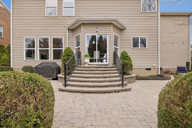 property entrance with a patio