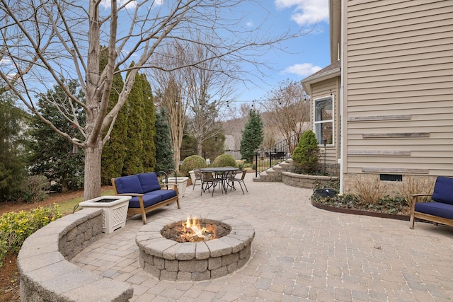 view of patio / terrace featuring an outdoor living space with a fire pit