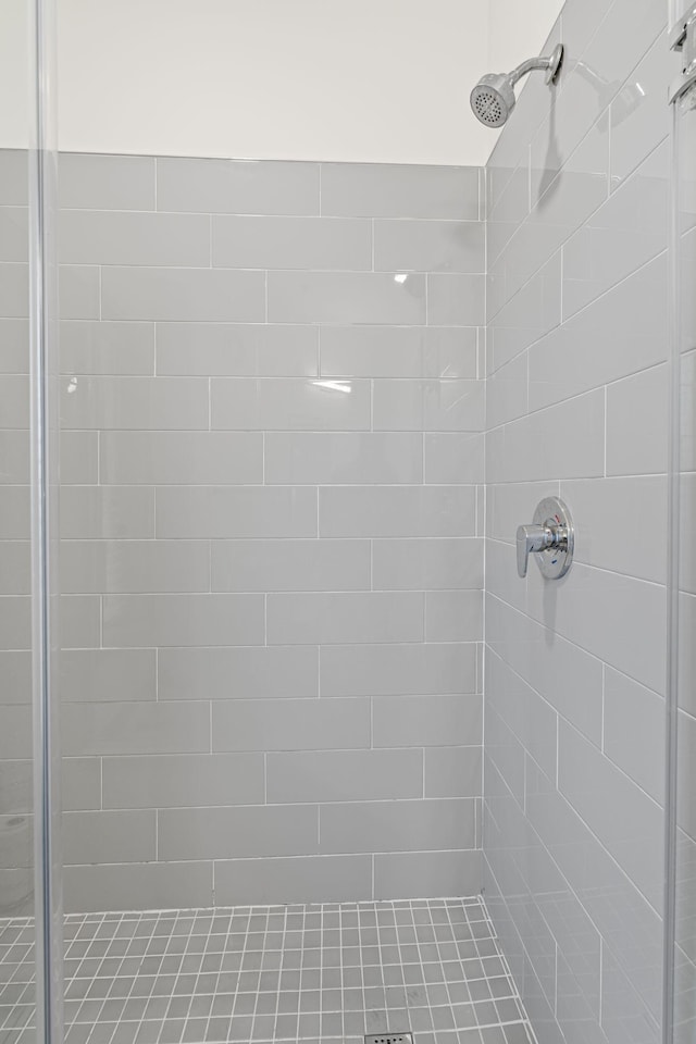 bathroom with a tile shower