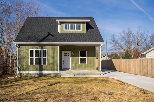 view of front of home featuring covered porch and a front yard