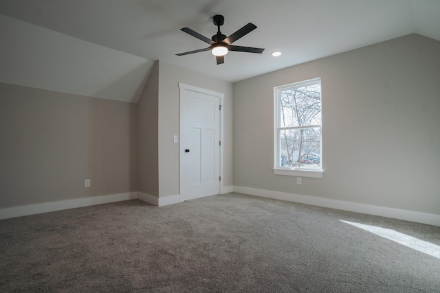 bonus room with vaulted ceiling, ceiling fan, and carpet floors