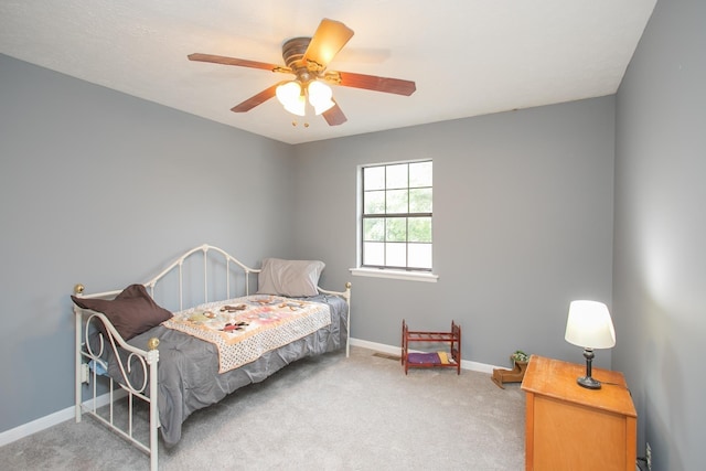 bedroom with ceiling fan and carpet