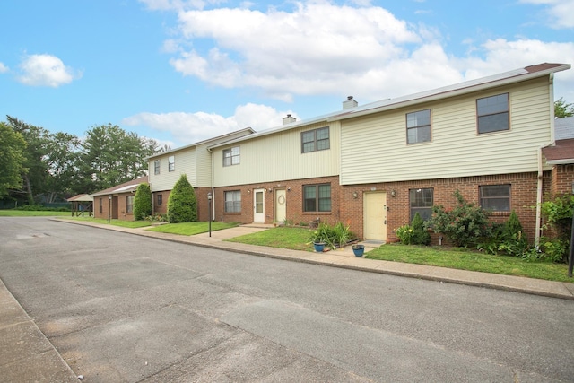 view of front of home with a front lawn