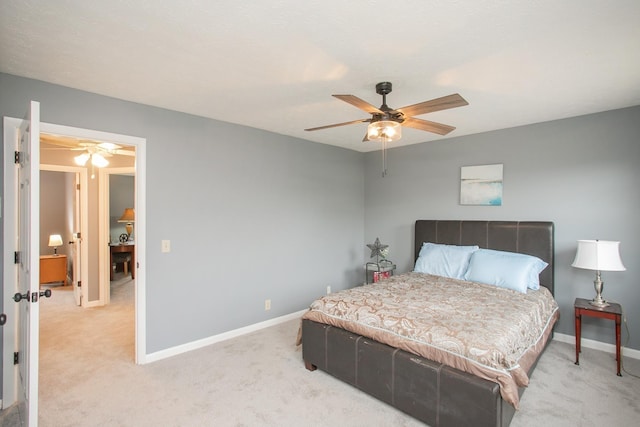 bedroom featuring light carpet and ceiling fan