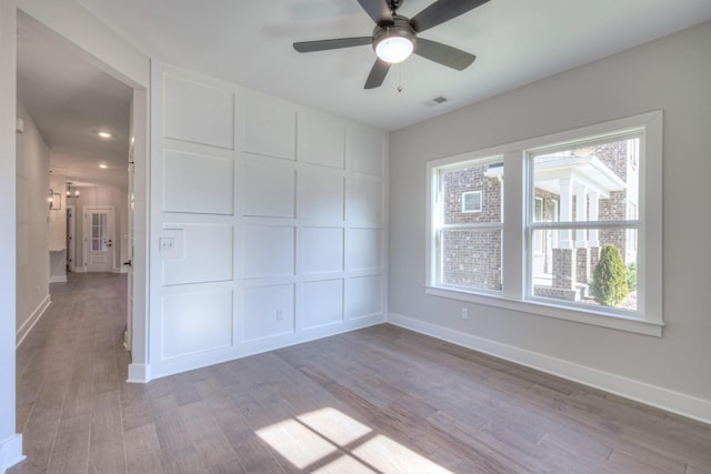 unfurnished room featuring ceiling fan and light hardwood / wood-style flooring