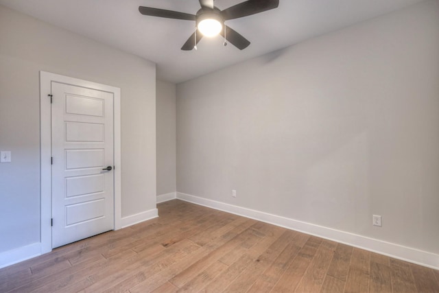 empty room featuring ceiling fan and light wood-type flooring