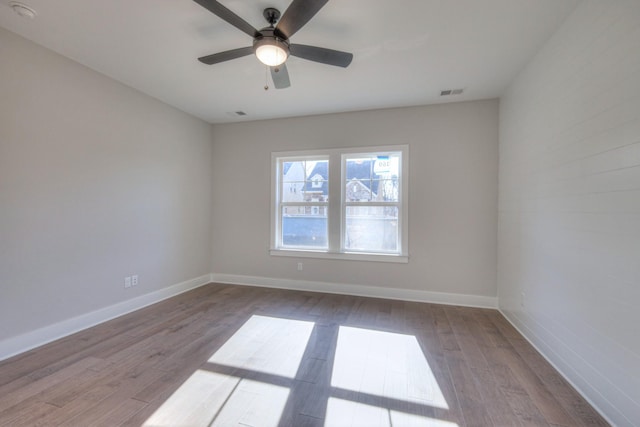 unfurnished room with ceiling fan and light hardwood / wood-style floors