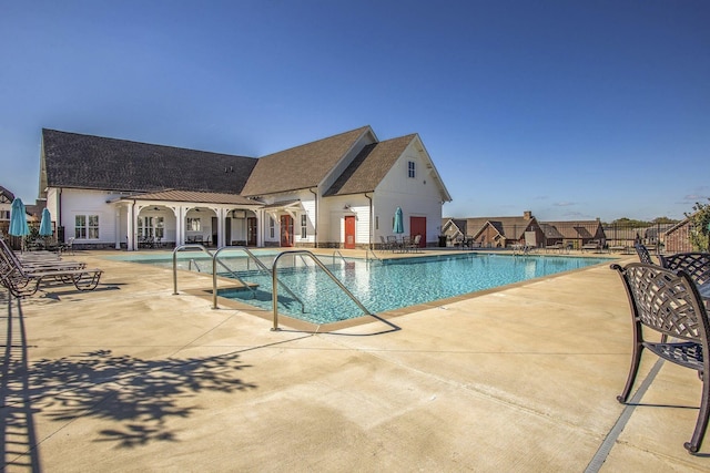 view of swimming pool featuring a patio