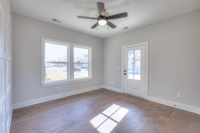 empty room with wood-type flooring and ceiling fan