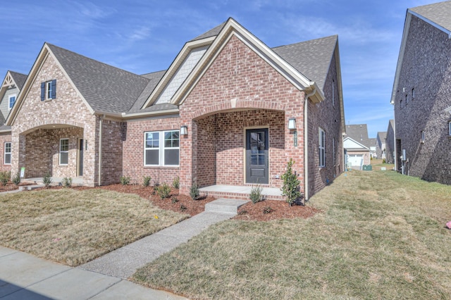 view of front of home featuring a front yard and covered porch