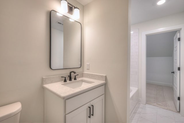 full bathroom featuring washtub / shower combination, vanity, and toilet