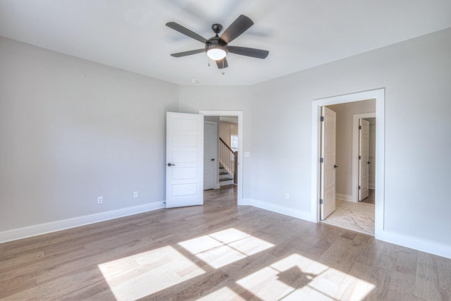 unfurnished bedroom featuring ceiling fan and light hardwood / wood-style floors