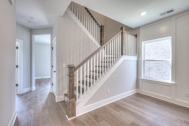 stairway with wood-type flooring