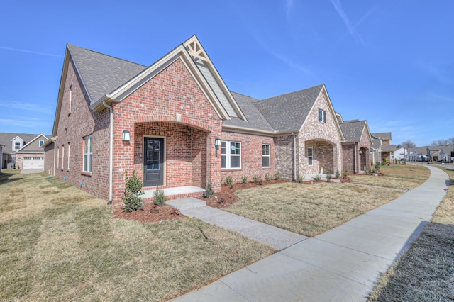 view of front of house with a garage and a front yard