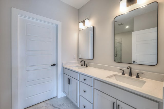 bathroom featuring vanity and walk in shower