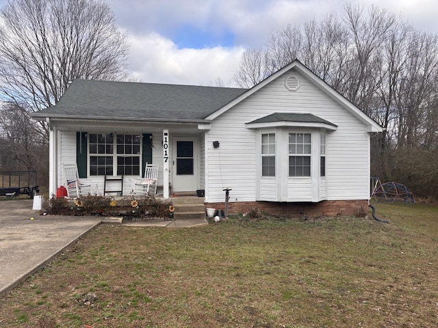 view of front of house with a porch and a front lawn