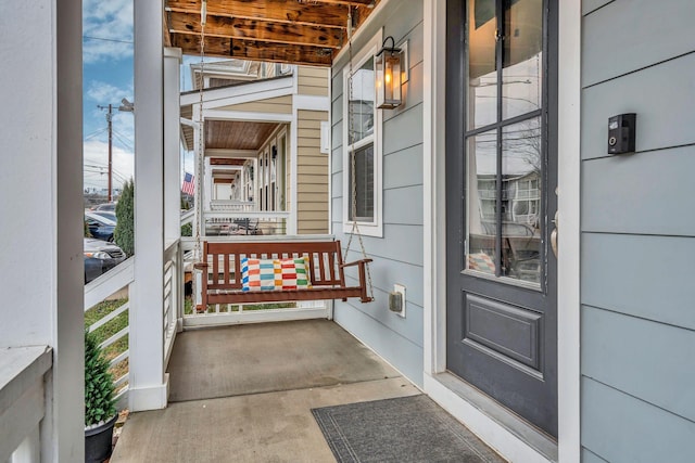 property entrance with covered porch