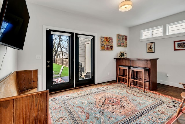 foyer featuring hardwood / wood-style flooring and indoor bar