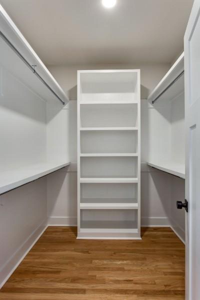 walk in closet featuring hardwood / wood-style flooring