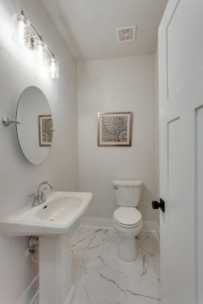 bathroom featuring toilet