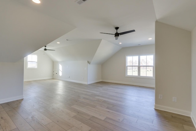 bonus room with vaulted ceiling, ceiling fan, and light hardwood / wood-style floors