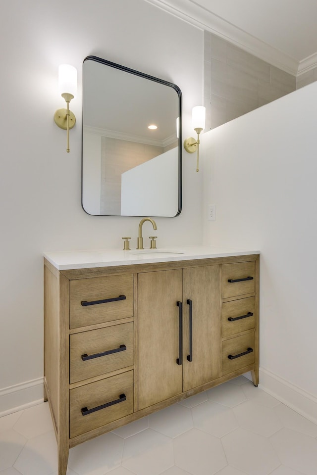 bathroom with crown molding and vanity