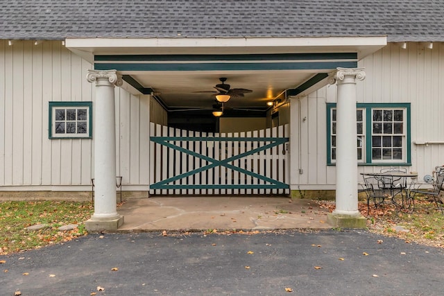 view of gate with ceiling fan