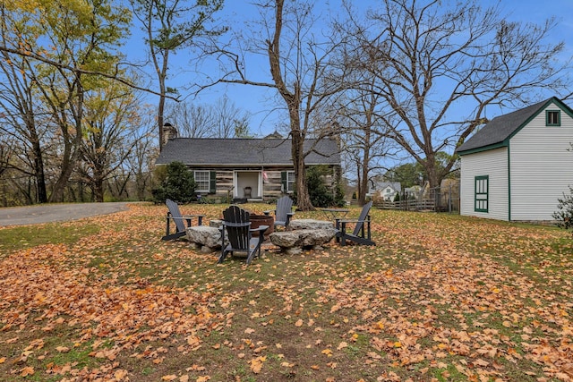 view of yard with a fire pit