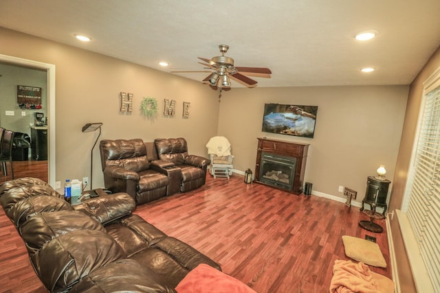 living room with hardwood / wood-style flooring and ceiling fan