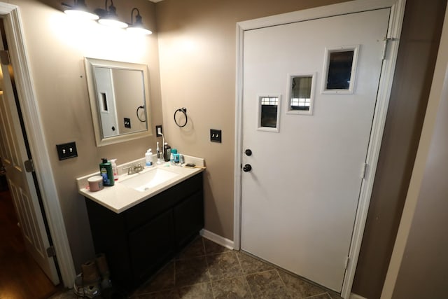 bathroom featuring tile patterned floors and vanity