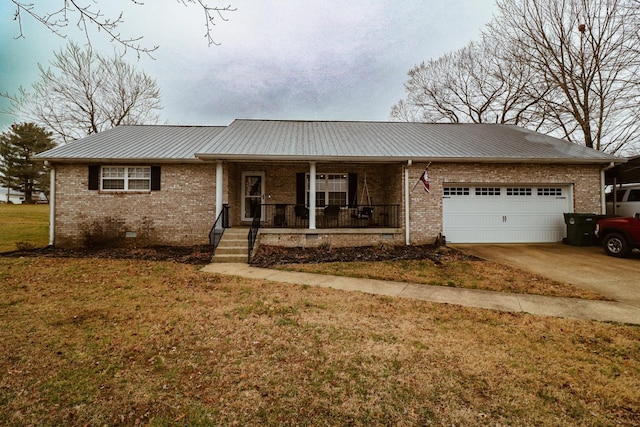 ranch-style house featuring a garage, covered porch, and a front lawn